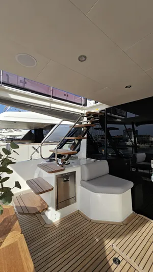 Diamond Si Yacht Photos Pics Luxurious 2024 Prestige M48 yacht interior with modern seating and wooden flooring.