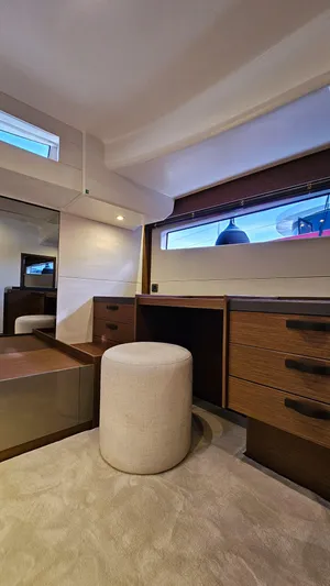 Diamond Si Yacht Photos Pics Luxurious interior of 2024 Prestige M48 yacht with elegant wood furnishings and plush seating.