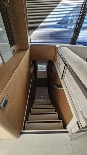 Diamond Si Yacht Photos Pics Staircase in 2024 Prestige M48 yacht with modern wood paneling and sleek design.