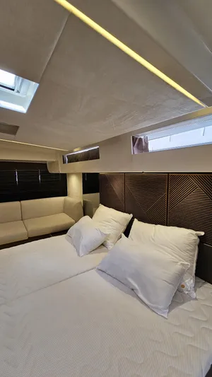 Diamond Si Yacht Photos Pics Luxurious interior of 2024 Prestige M48 yacht with elegant bedding and modern design.