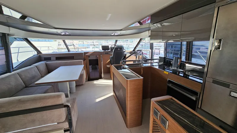 Diamond Si Yacht Photos Pics Luxurious interior of 2024 Prestige M48 yacht with modern furnishings and panoramic windows.