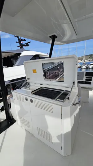Diamond Si Yacht Photos Pics 2024 Prestige M48 yacht outdoor kitchen with grill and storage, docked at marina.