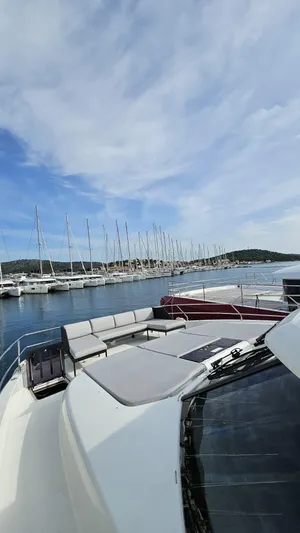 Diamond Si Yacht Photos Pics 2024 Prestige M48 yacht docked in a marina under a partly cloudy sky.