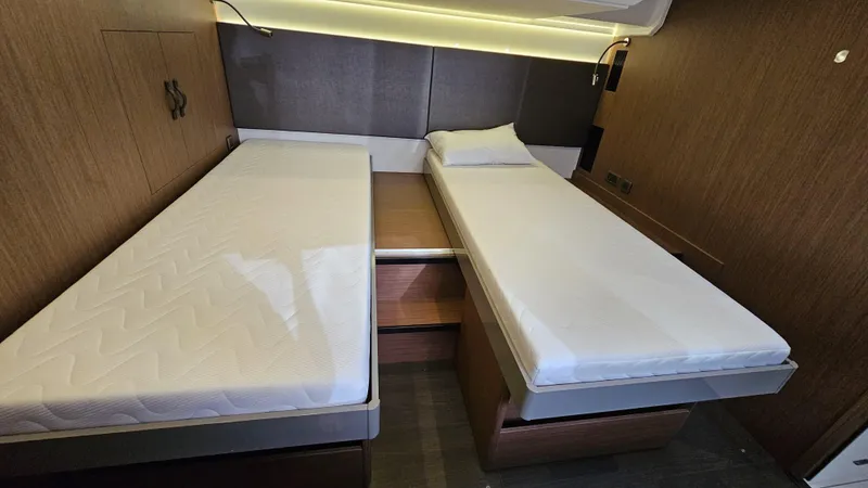 Diamond Si Yacht Photos Pics 2024 Prestige M48 interior with twin beds and modern wood paneling.