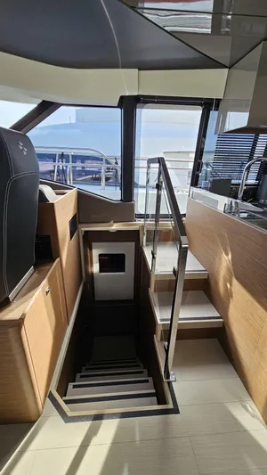 Diamond Si Yacht Photos Pics Interior view of 2024 Prestige M48 yacht, featuring modern staircase and sleek design elements.