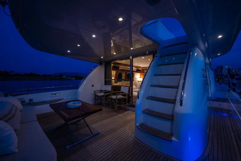 Pearl Yacht Photos Pics Luxurious 2002 Viking Princess 72 SportCruiser yacht deck at night with elegant lighting.
