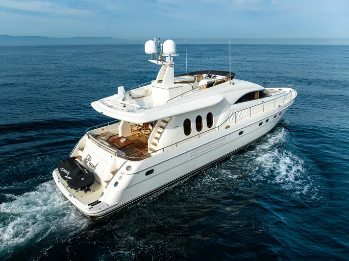 Pearl Yacht Photos Pics 2002 Viking Princess 72 SportCruiser yacht cruising on open water.