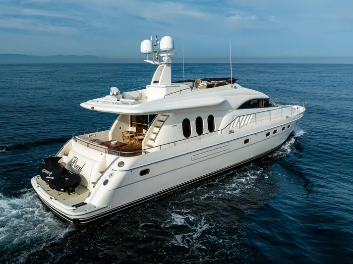 Pearl Yacht Photos Pics 2002 Viking Princess 72 SportCruiser yacht cruising on open water.