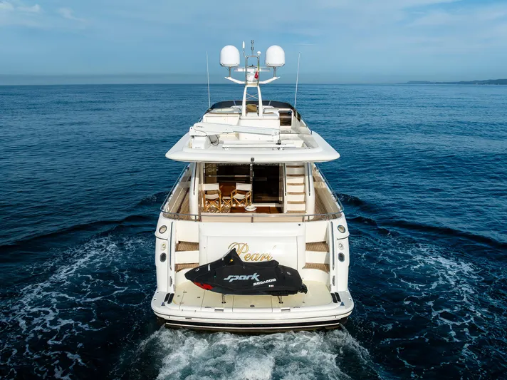 Pearl Yacht Photos Pics 2002 Viking Princess 72 SportCruiser yacht cruising on open water.