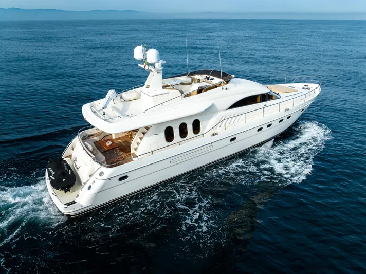 Pearl Yacht Photos Pics 2002 Viking Princess 72 SportCruiser yacht cruising on open water.