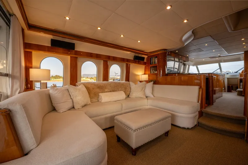 Pearl Yacht Photos Pics Luxurious interior of a 2002 Viking Princess 72 SportCruiser yacht with plush seating.