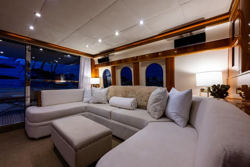 Pearl Yacht Photos Pics Luxurious interior of 2002 Viking Princess 72 SportCruiser with plush seating and ambient lighting.