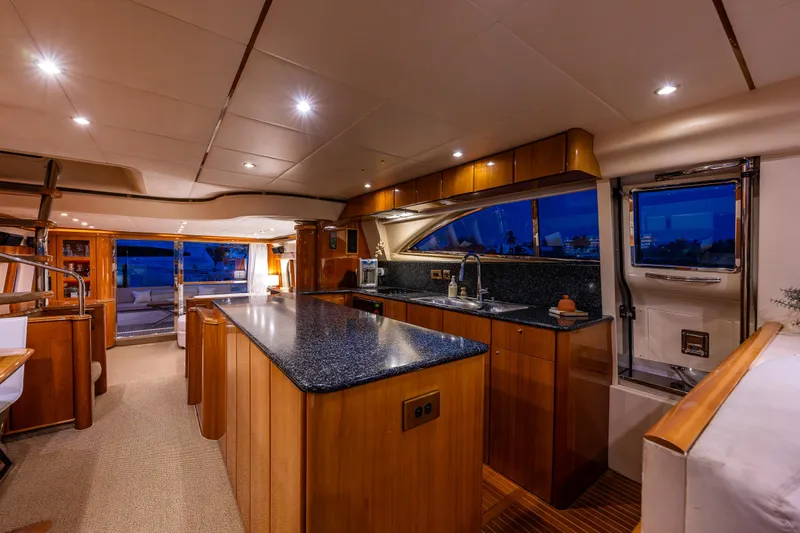 Pearl Yacht Photos Pics Luxurious interior of 2002 Viking Princess 72 SportCruiser yacht with modern kitchen.