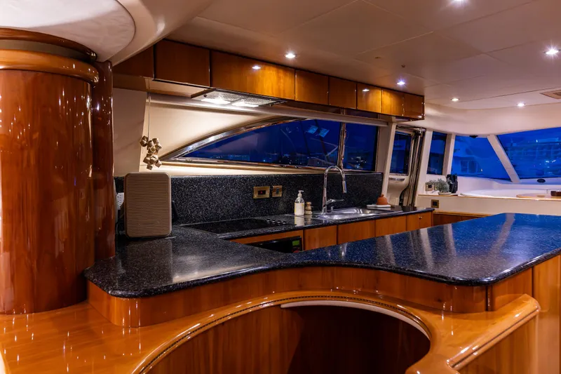 Pearl Yacht Photos Pics Luxurious kitchen interior of 2002 Viking Princess 72 SportCruiser yacht with sleek countertops.