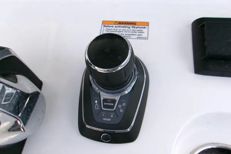  Yacht Photos Pics 2025 Sportsman Open 322 Center Console joystick control with Skyhook feature and warning label.