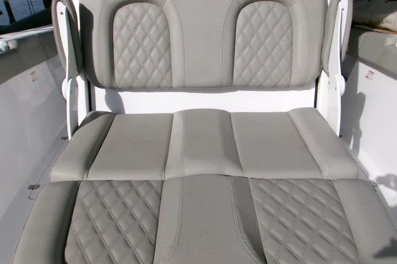  Yacht Photos Pics 2025 Sportsman Open 322 Center Console boat seat with diamond-stitched upholstery.
