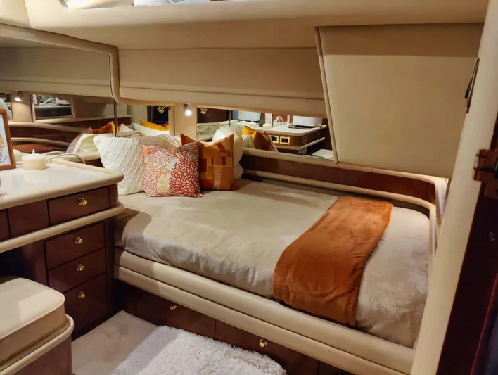 Wade N Winda Yacht Photos Pics Luxurious 1999 Sea Ray 560 Sedan Bridge cabin with cozy bed and elegant decor.