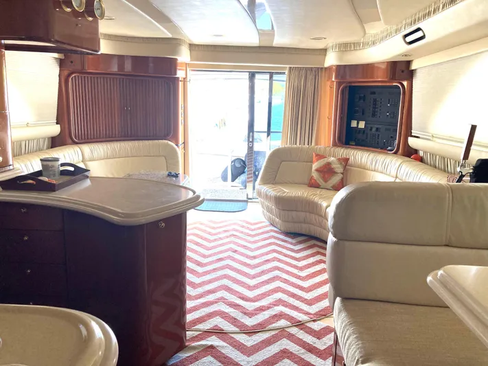Wade N Winda Yacht Photos Pics Luxurious interior of a 1999 Sea Ray 560 Sedan Bridge yacht with plush seating.