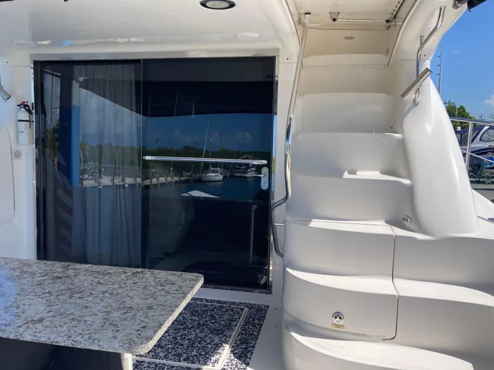 Wade N Winda Yacht Photos Pics 1999 Sea Ray 560 Sedan Bridge yacht with stairs and sliding glass door.