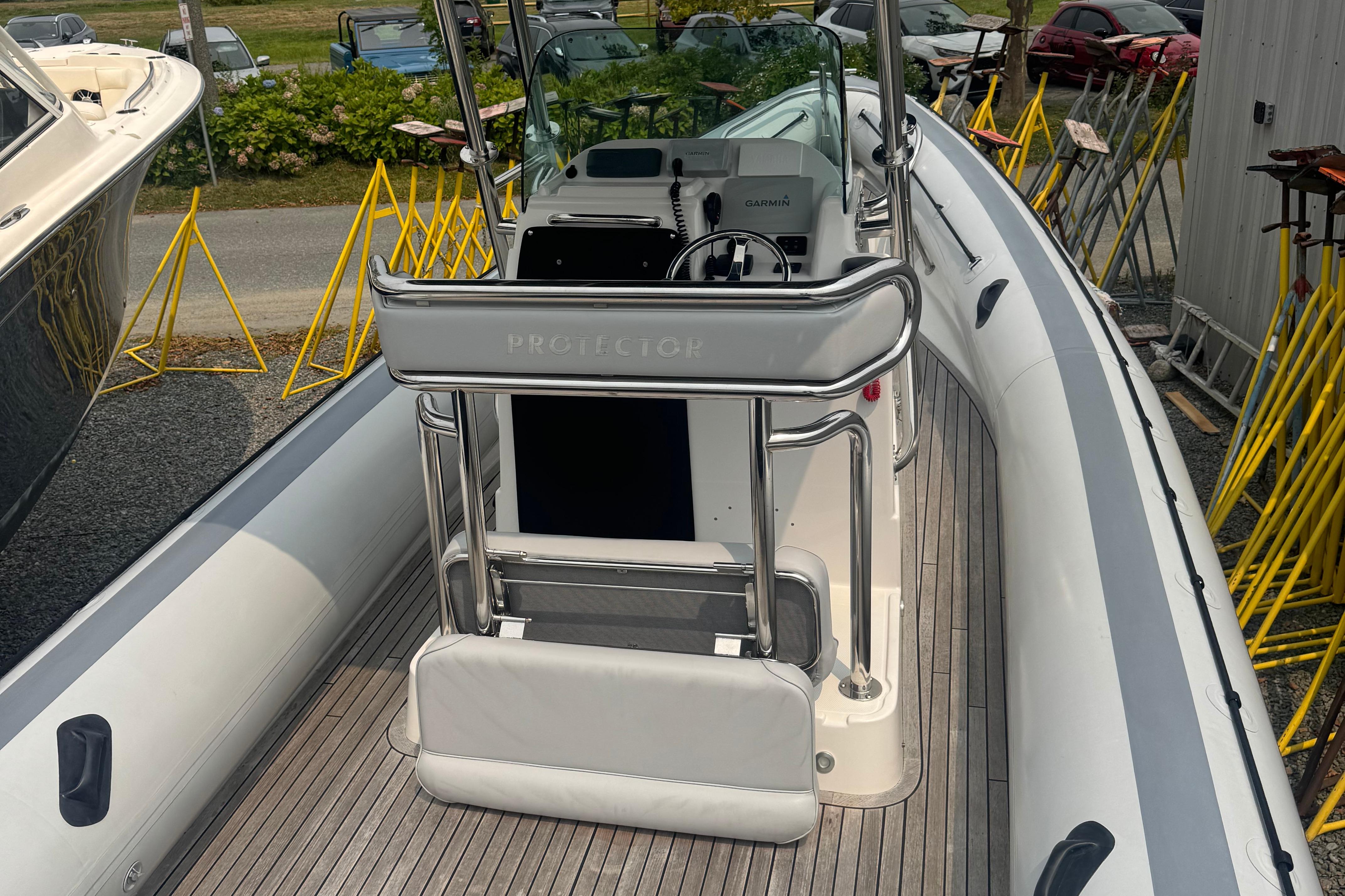2016 Protector 30 Center Console boat with sleek design and modern controls.