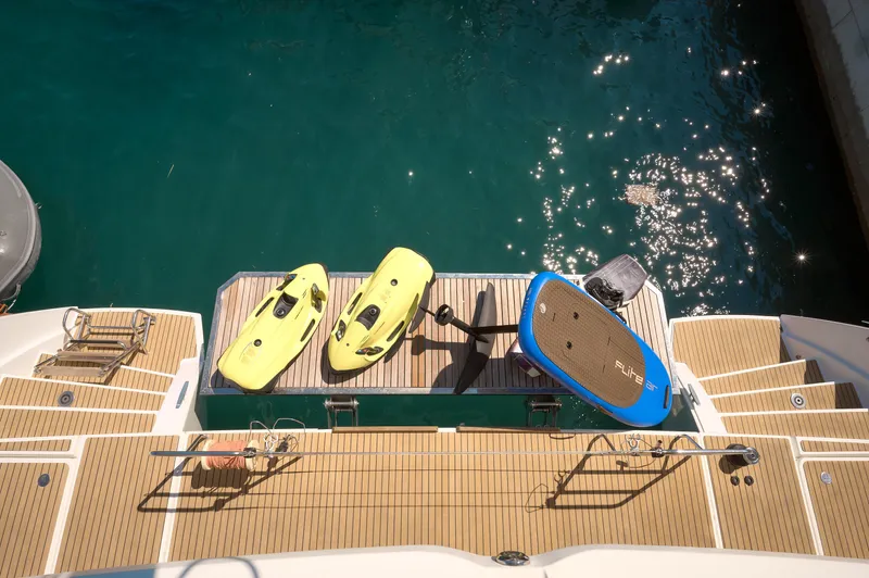 Yacht Photos Pics Lagoon 52 F yacht deck with water sports equipment, 2019 model.