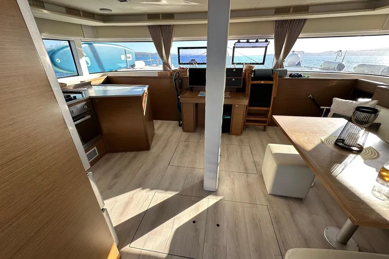  Yacht Photos Pics Interior of 2019 Lagoon 52 F yacht with modern kitchen and dining area.