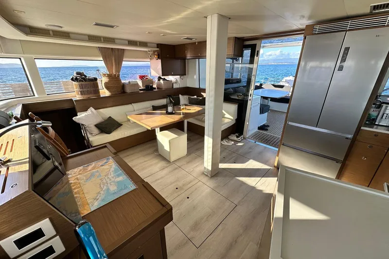  Yacht Photos Pics Luxurious interior of 2019 Lagoon 52 F yacht with ocean view and modern amenities.