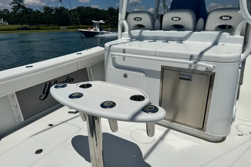  Yacht Photos Pics 2014 Yellowfin 42 Offshore boat interior with seating and rod holders.