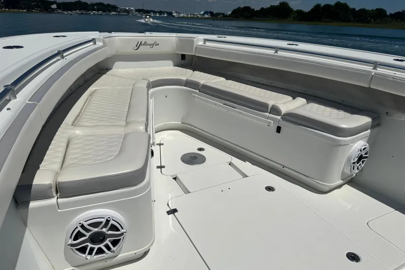  Yacht Photos Pics 2014 Yellowfin 42 Offshore boat with spacious seating and sleek design on the water.