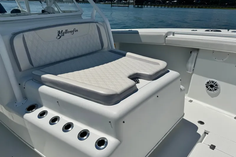  Yacht Photos Pics 2014 Yellowfin 42 Offshore boat interior with cushioned seating and rod holders.