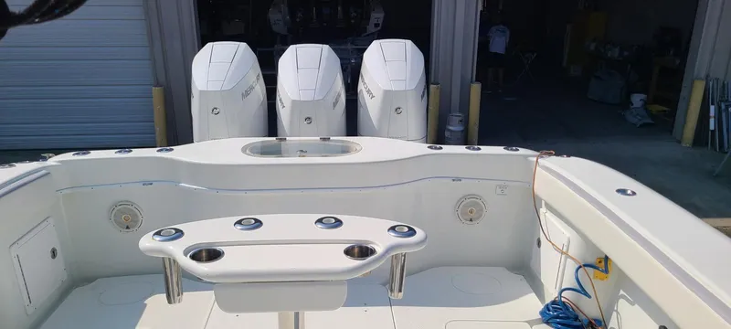 Yacht Photos Pics 2014 Yellowfin 42 boat with triple outboard engines and spacious deck layout.