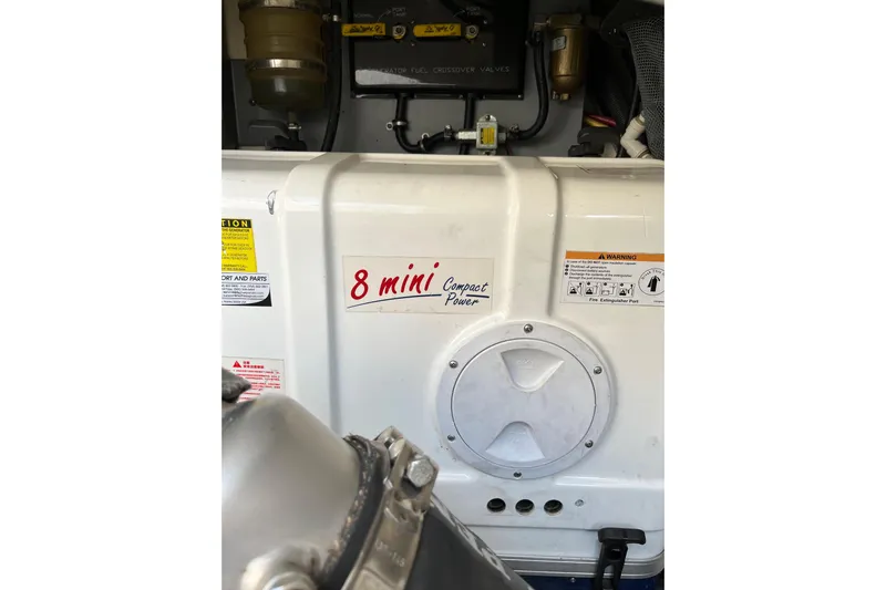  Yacht Photos Pics Engine compartment of 2015 Monterey 415 Sport Yacht with "8 mini Compact Power" label.