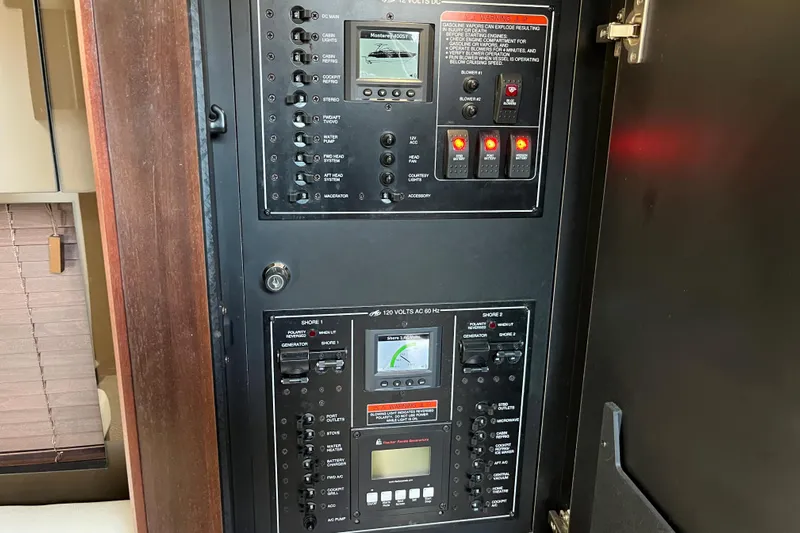  Yacht Photos Pics Electrical control panel inside 2015 Monterey 415 Sport Yacht, featuring switches and displays.