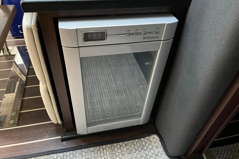  Yacht Photos Pics Compact Dometic fridge in 2015 Monterey 415 Sport Yacht interior.