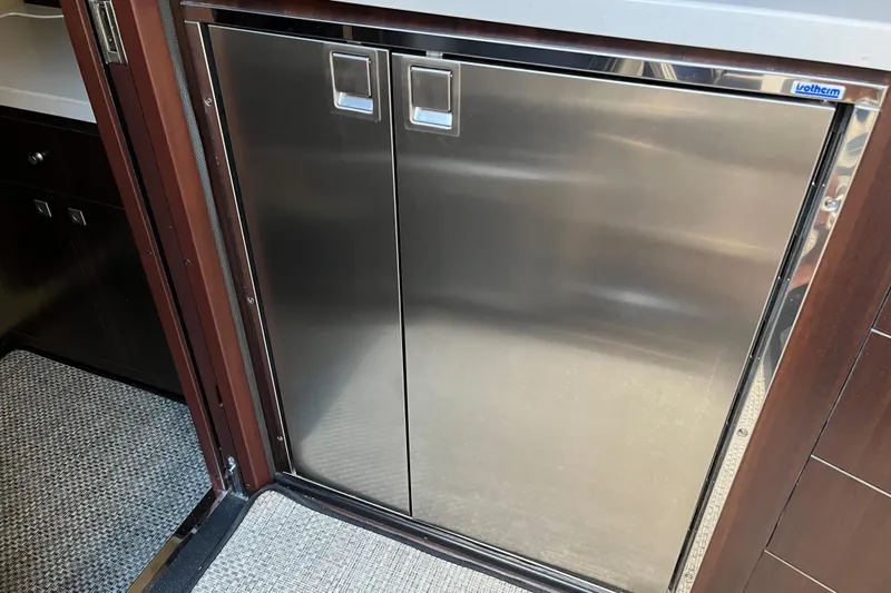  Yacht Photos Pics Stainless steel refrigerator in 2015 Monterey 415 Sport Yacht interior.