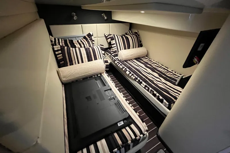  Yacht Photos Pics Interior of 2015 Monterey 415 Sport Yacht with striped bedding and modern design.