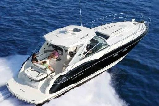  Yacht Photos Pics 2015 Monterey 415 Sport Yacht cruising on open water, aerial view.