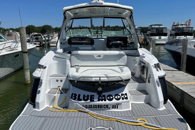  Yacht Photos Pics 2015 Monterey 415 Sport Yacht docked at marina, rear view with seating and deck.