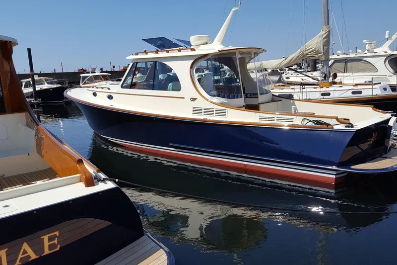 Standish Yacht Photos Pics 2017 Hinckley Picnic Boat 37 MKIII docked in a marina, showcasing elegant design.