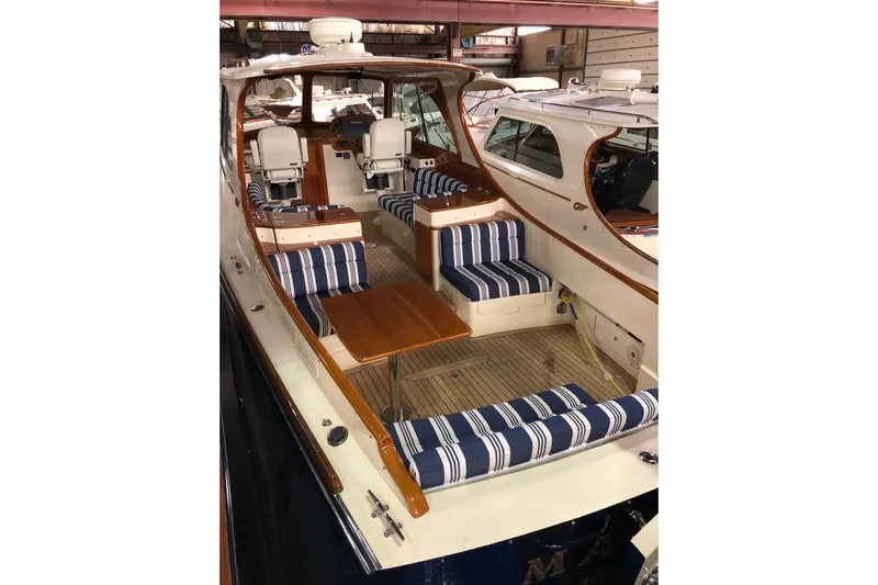 Standish Yacht Photos Pics 2017 Hinckley Picnic Boat 37 MKIII with striped seating and wooden interior.