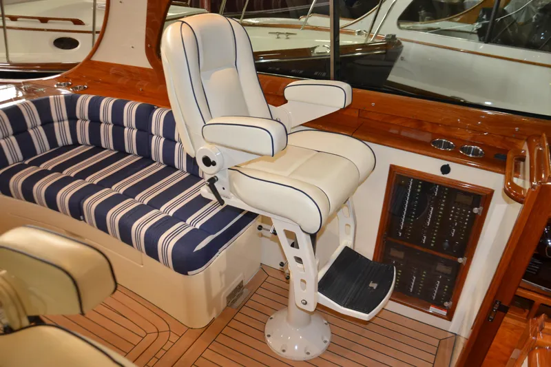 Standish Yacht Photos Pics Luxurious interior of 2017 Hinckley Picnic Boat 37 MKIII with plush seating and elegant helm chair.