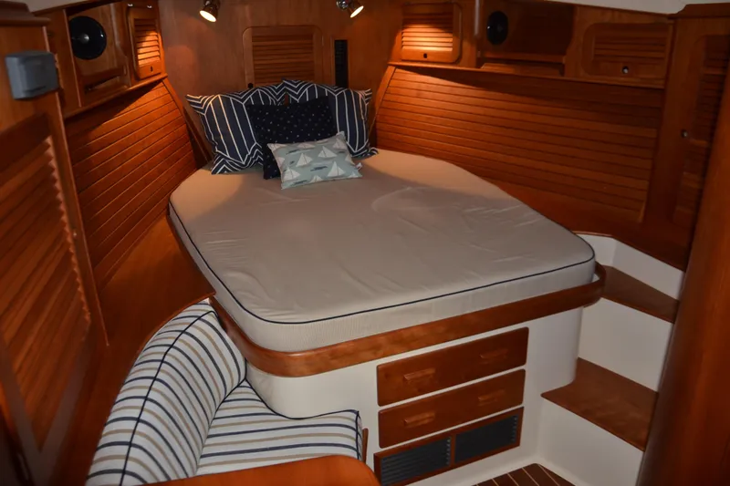 Standish Yacht Photos Pics 2017 Hinckley Picnic Boat 37 MKIII cabin with cozy bed and wooden interior.