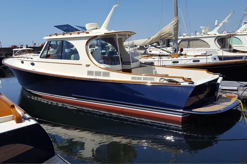 Standish Yacht Photos Pics 2017 Hinckley Picnic Boat 37 MKIII docked in marina, elegant design, blue hull.