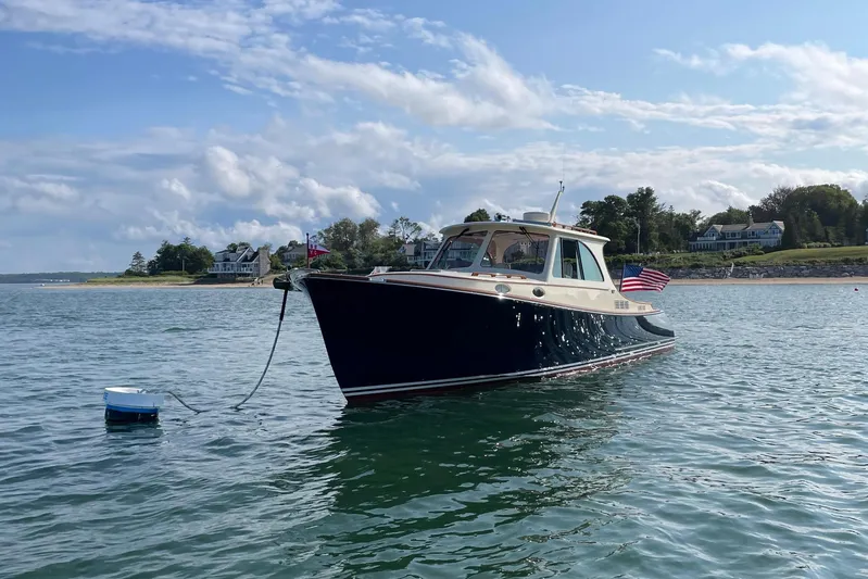 Standish Yacht Photos Pics 2017 Hinckley Picnic Boat 37 MKIII on calm water under blue sky.