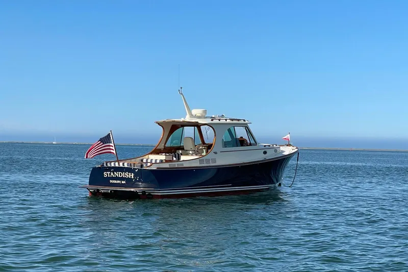 Standish Yacht Photos Pics 2017 Hinckley Picnic Boat 37 MKIII on calm blue water under clear sky.