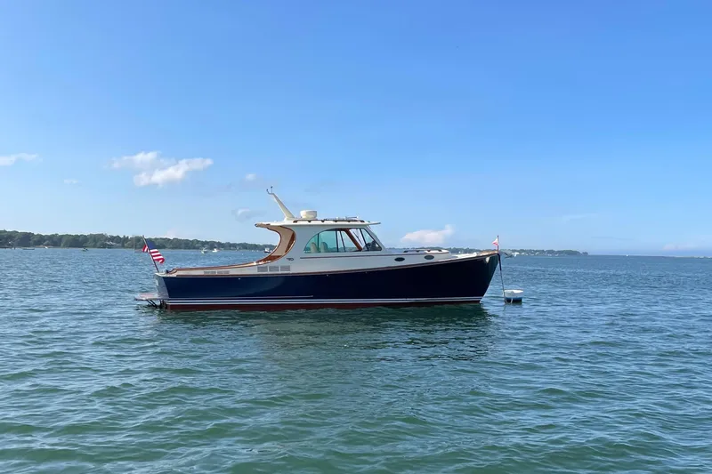 Standish Yacht Photos Pics 2017 Hinckley Picnic Boat 37 MKIII on calm water under clear blue sky.