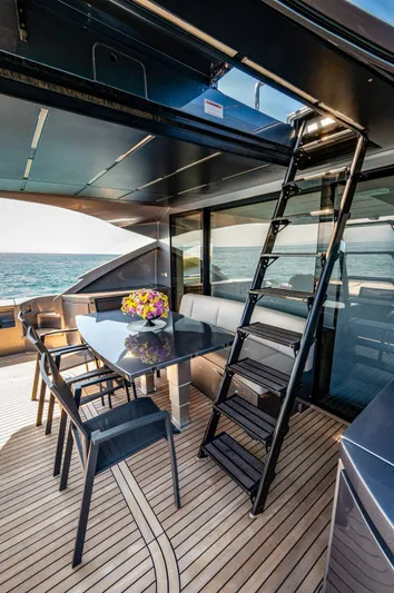  Yacht Photos Pics Luxurious 2019 Pershing 82 yacht deck with dining area and ocean view.