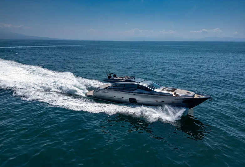  Yacht Photos Pics 2019 Pershing 82 yacht cruising on open sea under clear blue sky.