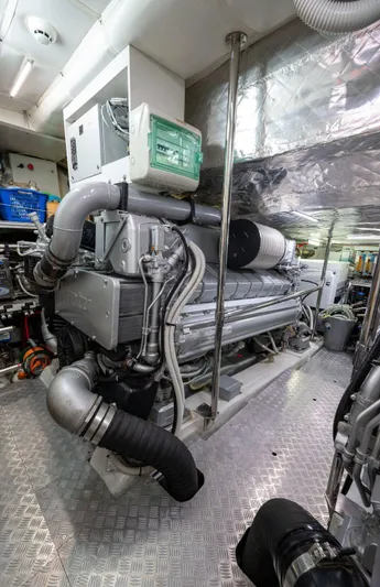 Yacht Photos Pics Engine room of a 2019 Pershing 82 yacht, showcasing advanced machinery and equipment.