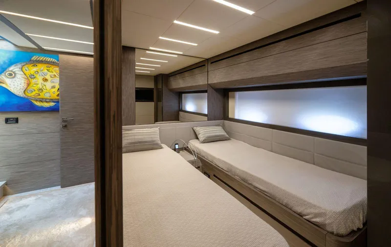  Yacht Photos Pics Luxurious 2019 Pershing 82 yacht cabin with twin beds and modern decor.